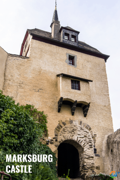 Marksburg castle gate with text overlay that says marksburg castle