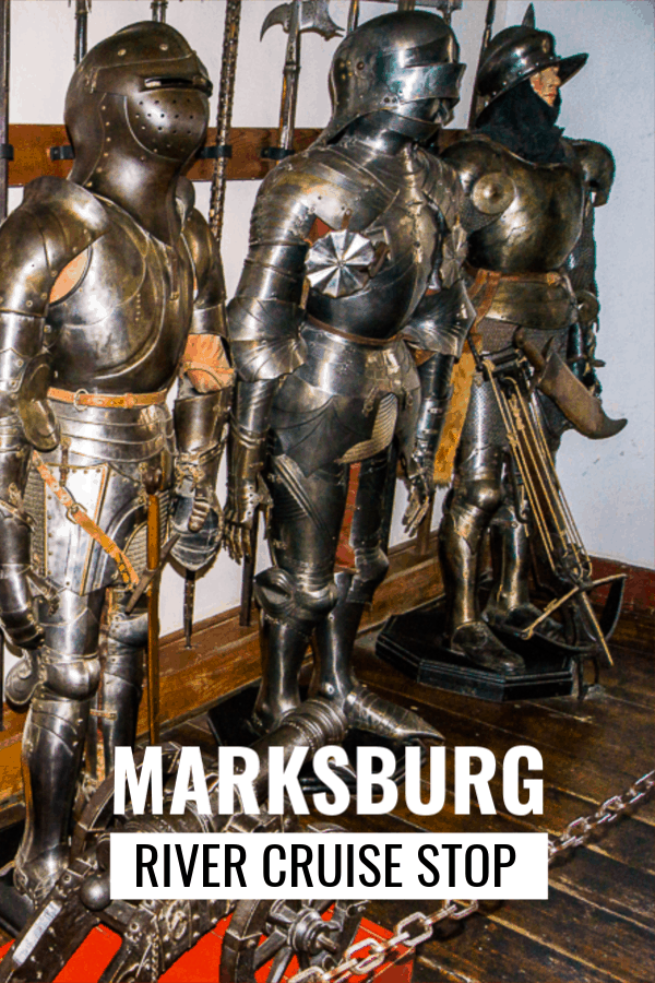 Armor on display at Marksburg Castle near Koblenz Germany. Text overlay says Marksburg River Cruise Stop