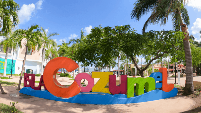 Colorful letters spell out Cozumel on the beach